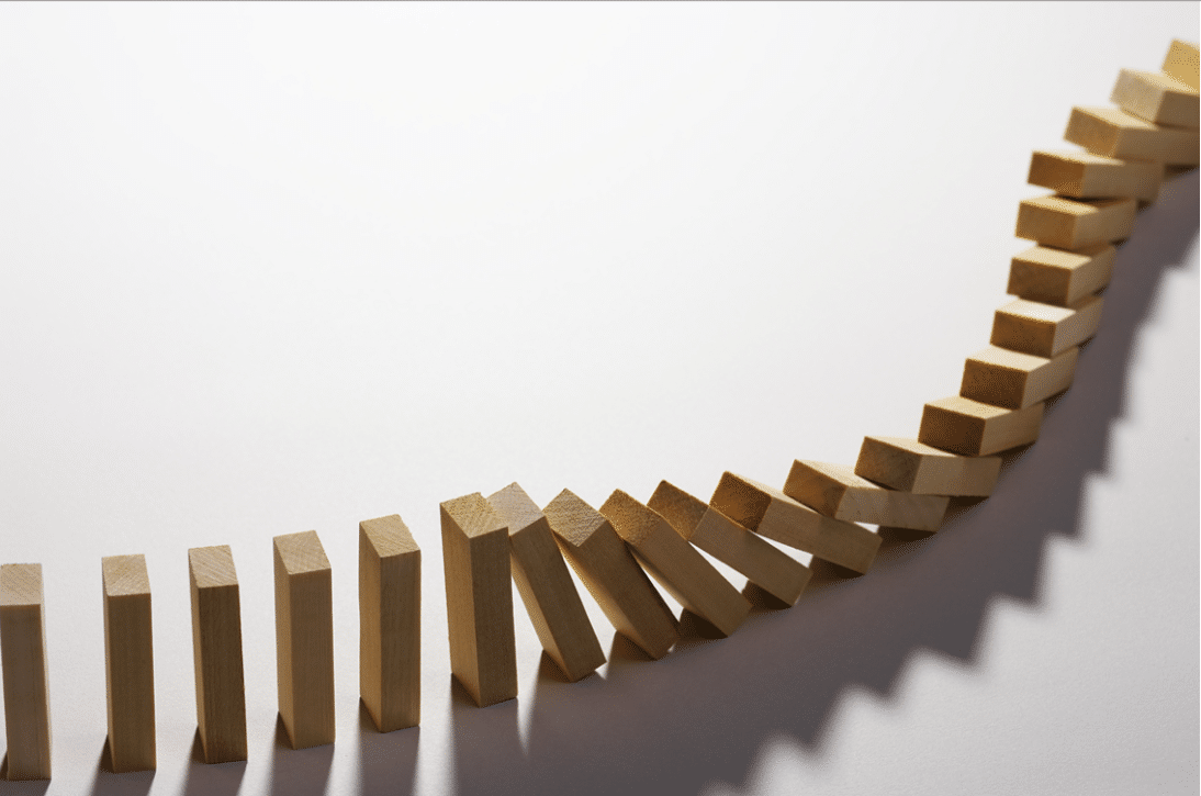 An image of dominoes falling. A representation of becoming a Regenerative Leader.